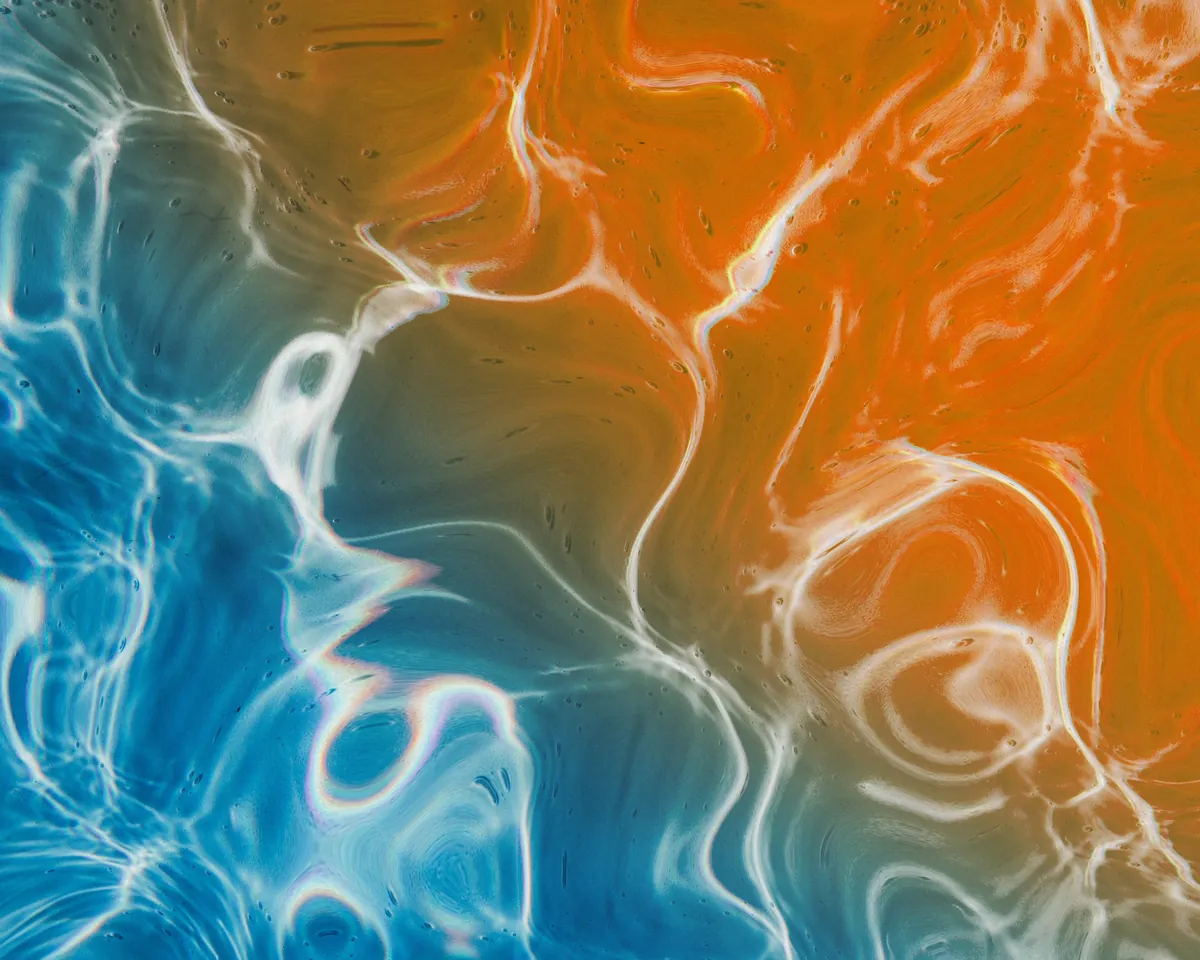 Hot orange and cool blue meeting in a fluid abstract