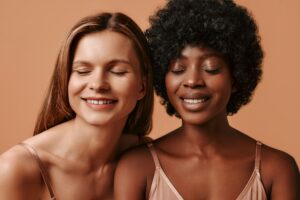 Multiethnic women on beige background